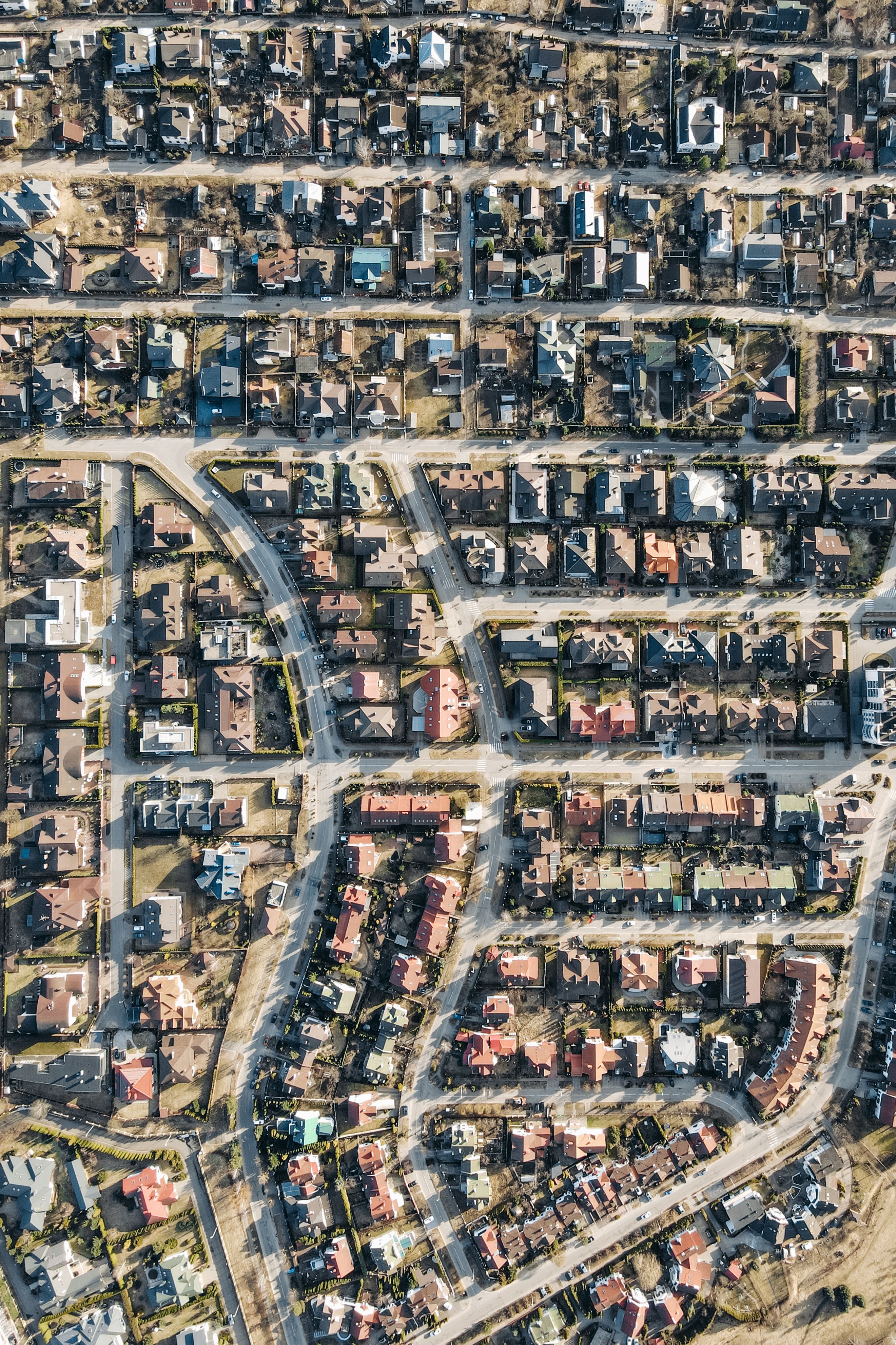 Aerial view of streets and homes in a suburban neighborhood